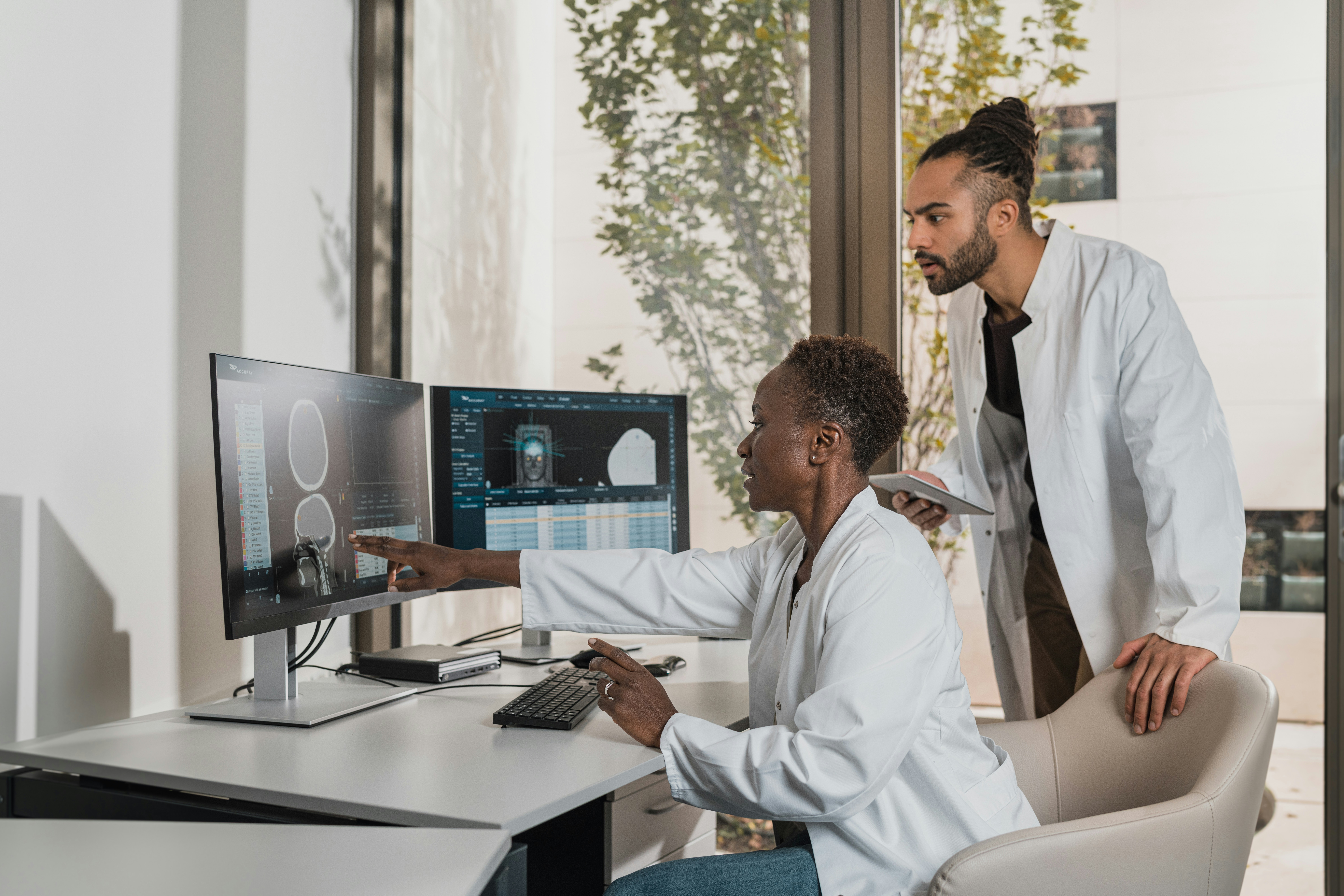 Doctors investigating patient diagnostics